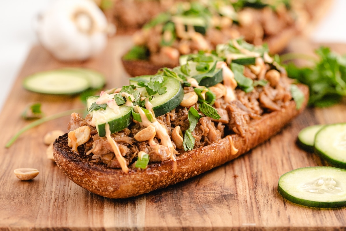 These Open-Faced Thai Chicken Sandwiches are a perfect mix of fresh flavors, with leftover rotisserie chicken, crisp veggies, and a Chili-Garlic Mayo that ties it all together—so easy, you'll be making them all the time. open faced sandwich Thai