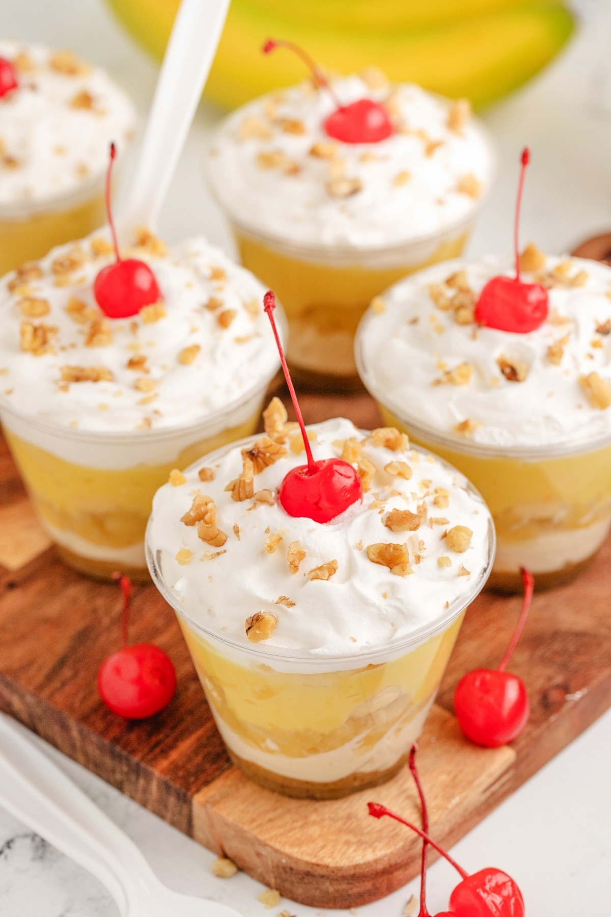 These No-Bake Banana Split "Cakes" are streamlined into cute, individual portions. Perfect for your next gathering—easy to serve, no oven needed, and just the right amount of sweetness. no bake dessert banana split