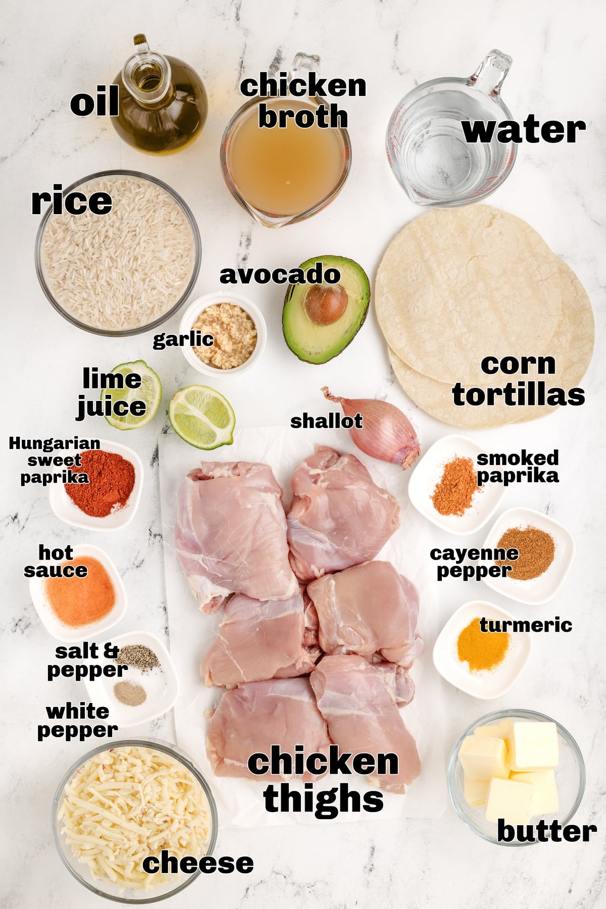 Chicken Paprikash Tacos ingredients All the ingredients laid out: chicken thighs, spices, tortillas, cheese, avocado, and lime.