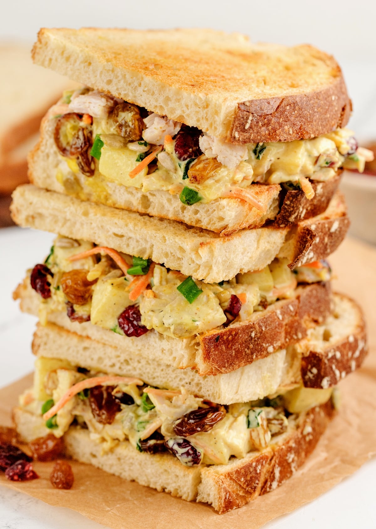 A triple stack of leftover curried turkey salad sandwiches