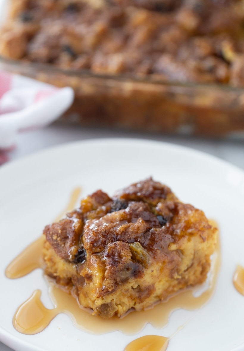Baked Overnight Panettone Eggnog French Toast casserole with a slice removed.
