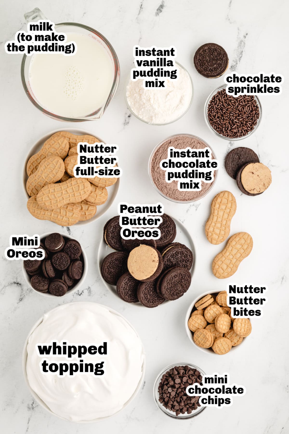 No-bake icebox cake ingredients with Nutter Butters, Oreos, pudding, and whipped topping Ingredients for peanut butter chocolate icebox cake including cookies, pudding mixes, and whipped topping