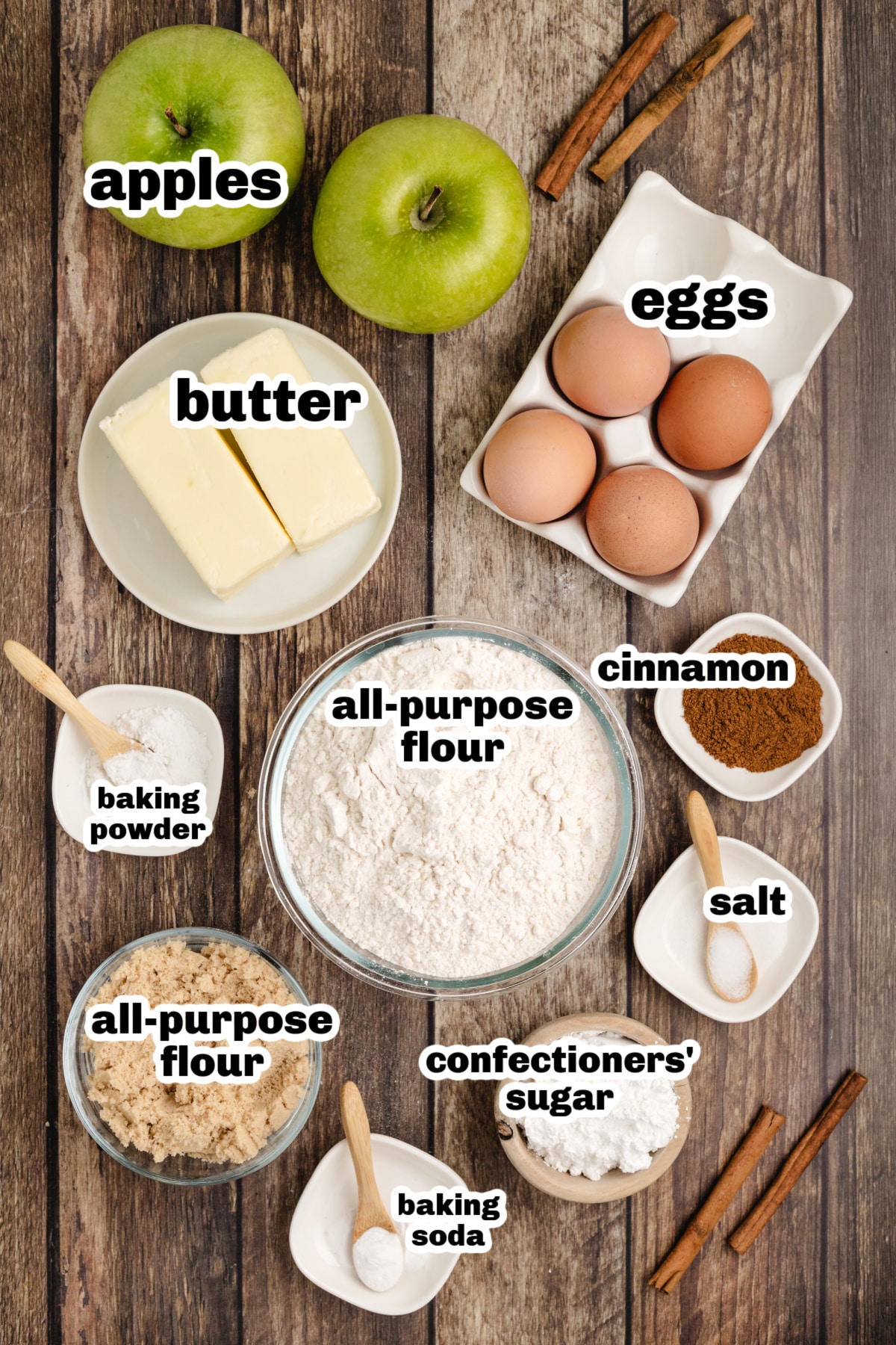 Ingredients laid out for cinnamon apple bundt cake including flour, apples, butter, eggs, and spices