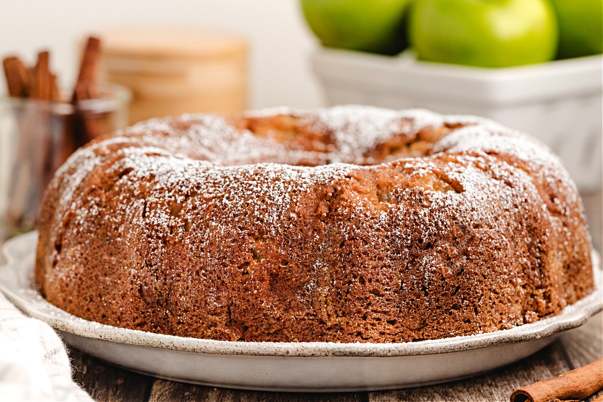 Whole apple bundt cake recipe baked in a Bundt pan and dusted with powdered sugar