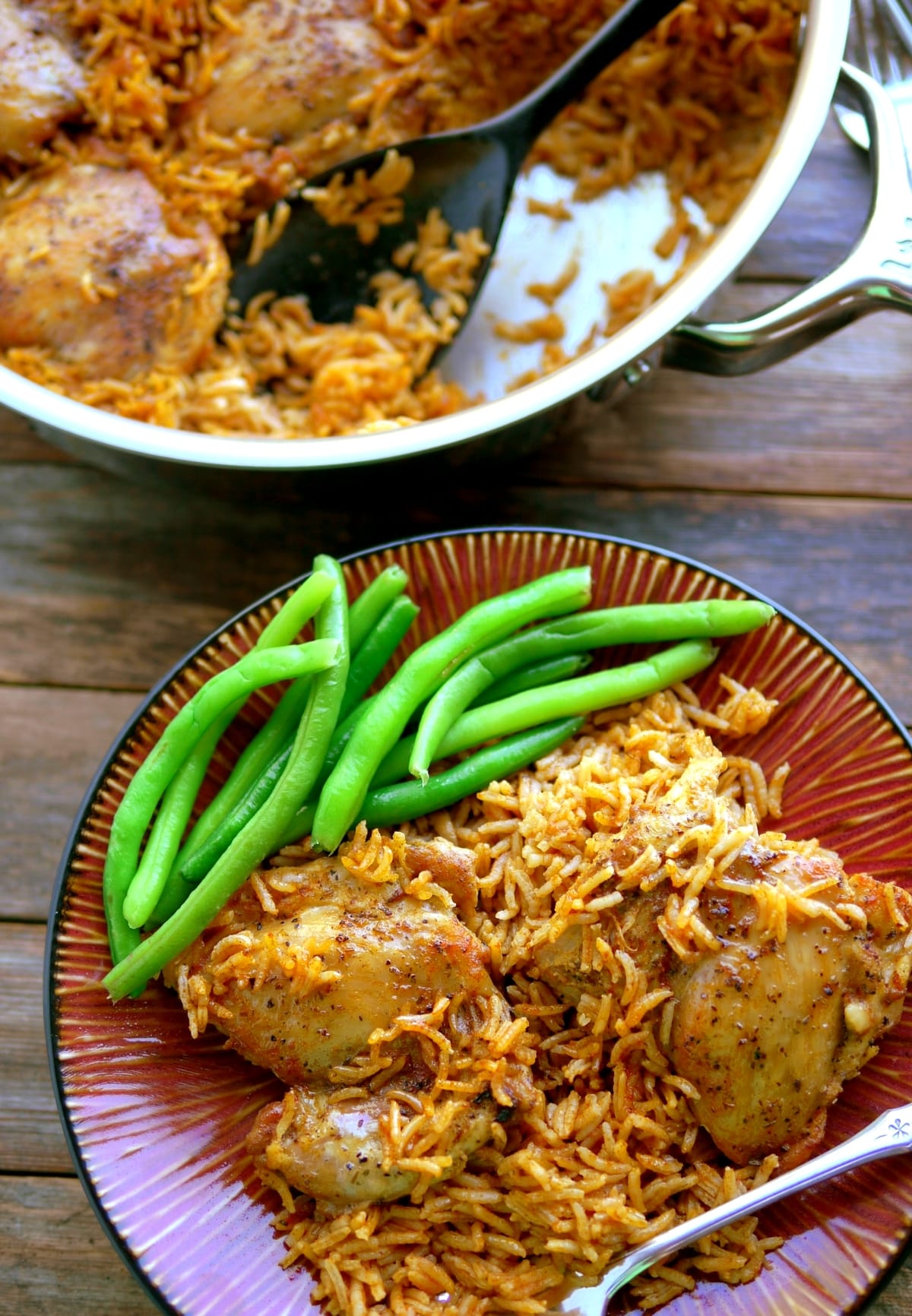 This stove top chicken and rice has been perfected over the years, with all the flavor and spice you'd expect in a weekend dish. The best part is, it’s still easy enough to throw together on a busy weeknight. rice and chicken on the stove