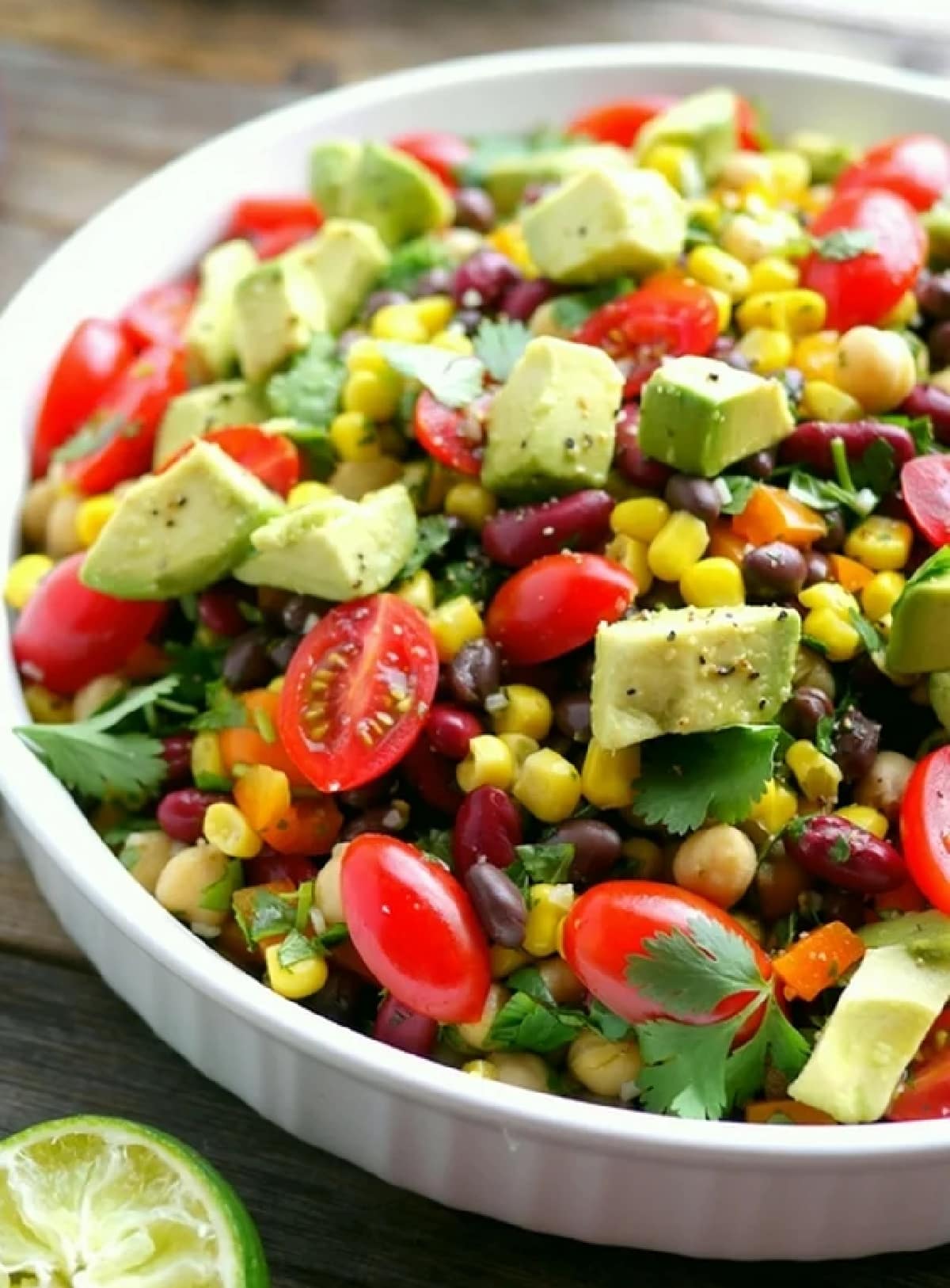 Top-down view of the salad with a focus on the fresh herbs, showing chopped cilantro evenly distributed throughout.