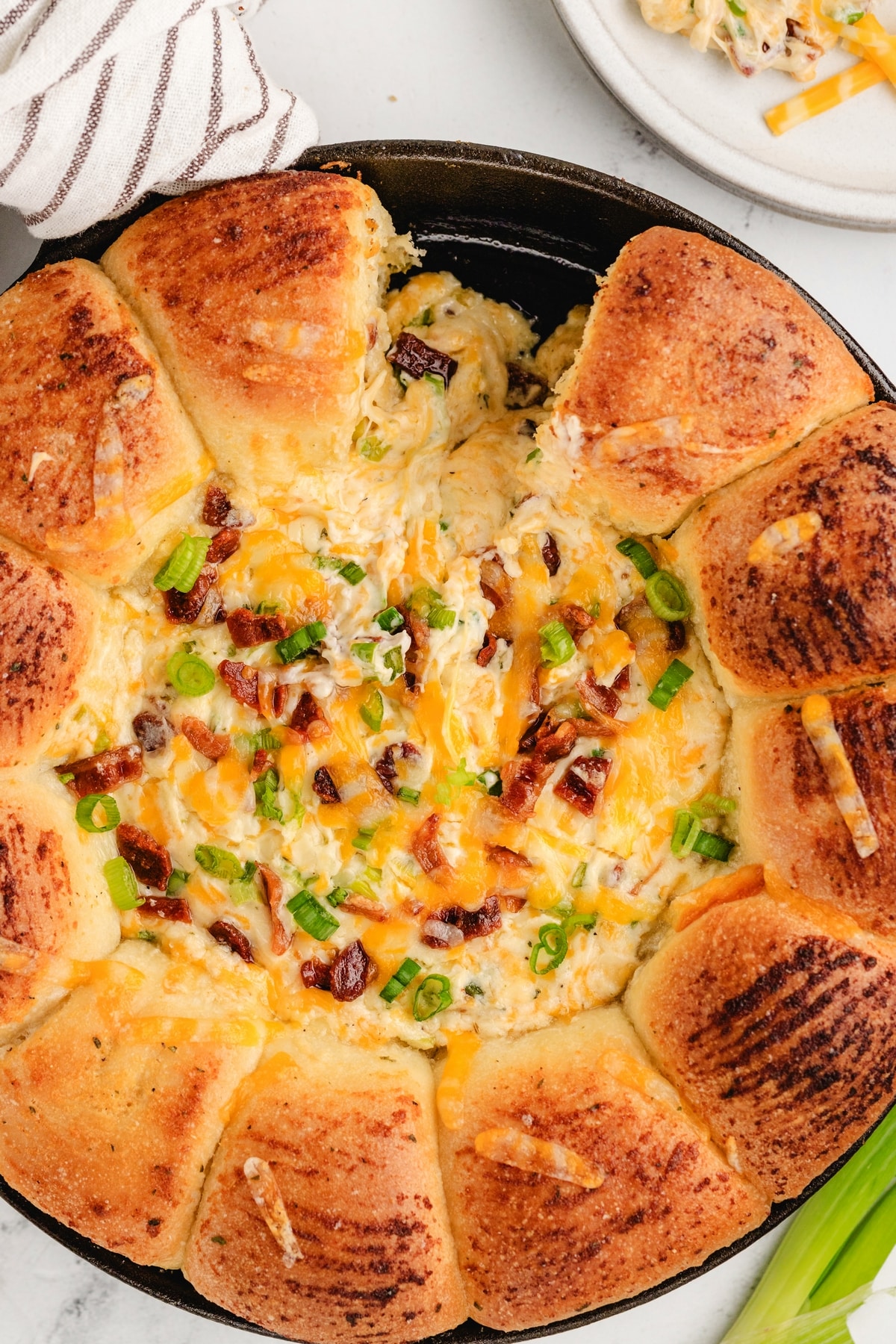 Sliced Sour Cream Bacon Ranch Ring Dip with Crispy Bacon Topping Sliced portion of sour cream bacon ranch ring dip showing creamy interior and crispy bacon topping.