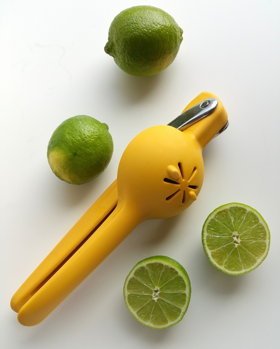 Why would you want to drink anything other than the World's Best Cosmopolitan Cocktail? The only thing girly about this cosmo drink is its color. Citrus squeezer with whole and cut limes.