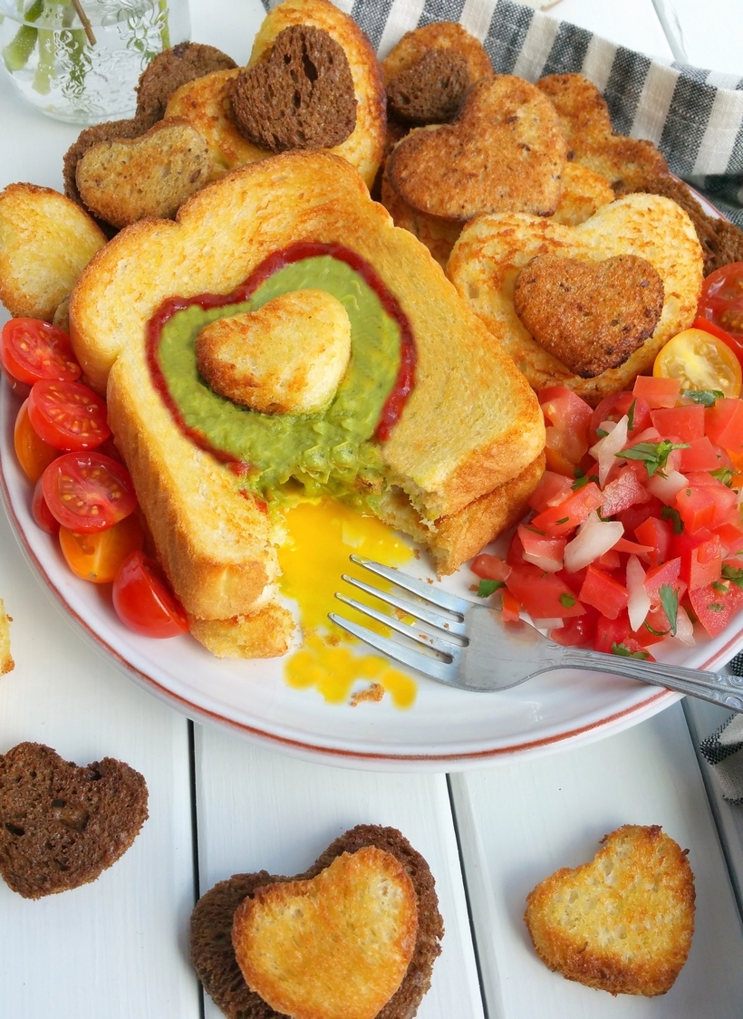Let Mom sleep in and then wake up to a delicious, restaurant-quality, avocado style, Mother's Day breakfast in bed. If your Mom is anything like me, she will appreciate those extra winks and a thoughtful meal that pays homage to her love of avocados, with a surprise egg underneath. This gorgeous breakfast plate is easy enough for children of all ages to help prepare from NoblePig.com. #noblepig #mothersday #avocado #breakfastinbed #avocadotoast #simplyavocado #whollyguacamole