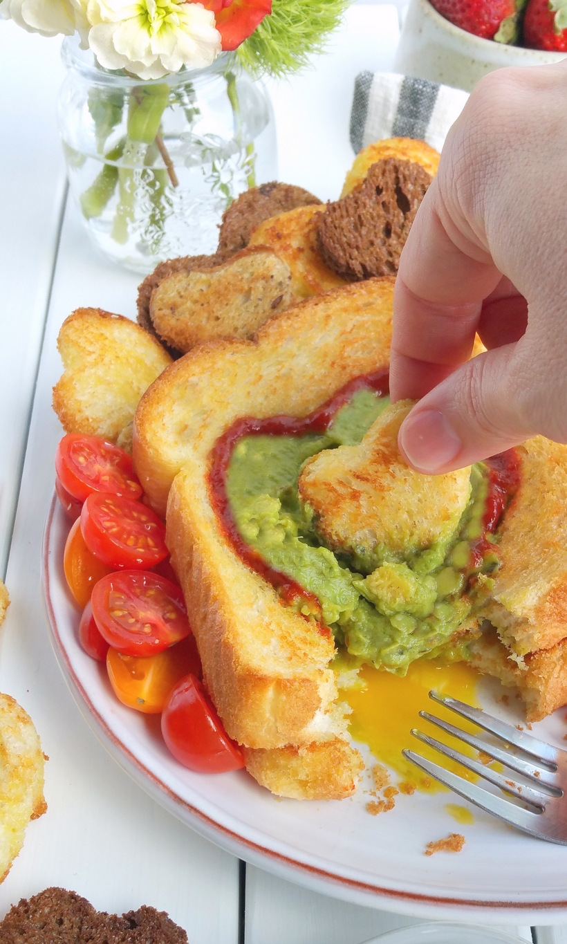 Let Mom sleep in and then wake up to a delicious, restaurant-quality, avocado style, Mother's Day breakfast in bed. If your Mom is anything like me, she will appreciate those extra winks and a thoughtful meal that pays homage to her love of avocados, with a surprise egg underneath. This gorgeous breakfast plate is easy enough for children of all ages to help prepare from NoblePig.com. #noblepig #mothersday #avocado #breakfastinbed #avocadotoast #simplyavocado #whollyguacamole