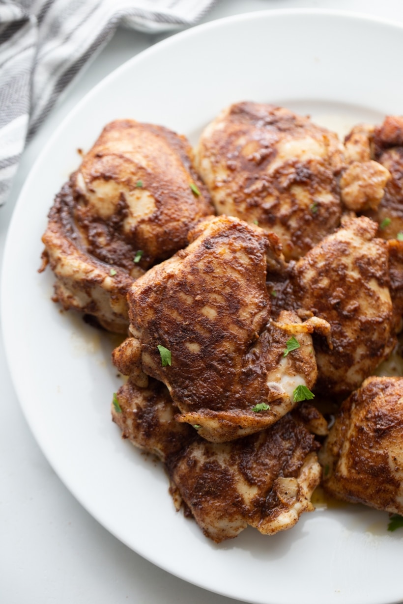 Top view of crispy, golden-brown Air Fryer Caribbean Spiced Chicken on a plate, ready to serve.