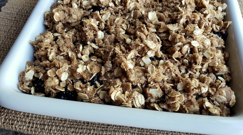 Nothing tastes more like late summer than a Blackberry Crumble. Even if you've never baked from scratch, you will find this recipe so easy to put together. #noblepig #blackberry #crumble #summerdessert Crumble topping in a serving dish.