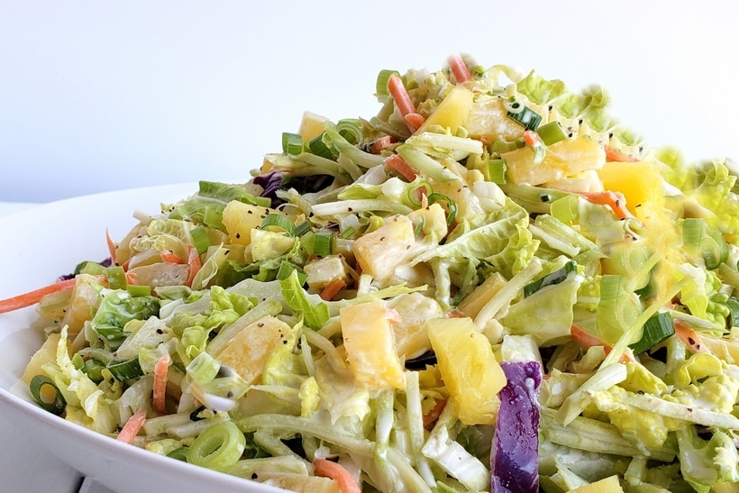 This Easy Pineapple Coleslaw is going to remind you of summer all year long. Enjoy as a side dish or top your favorite chicken burger with this one. easy pineapple colesalw
