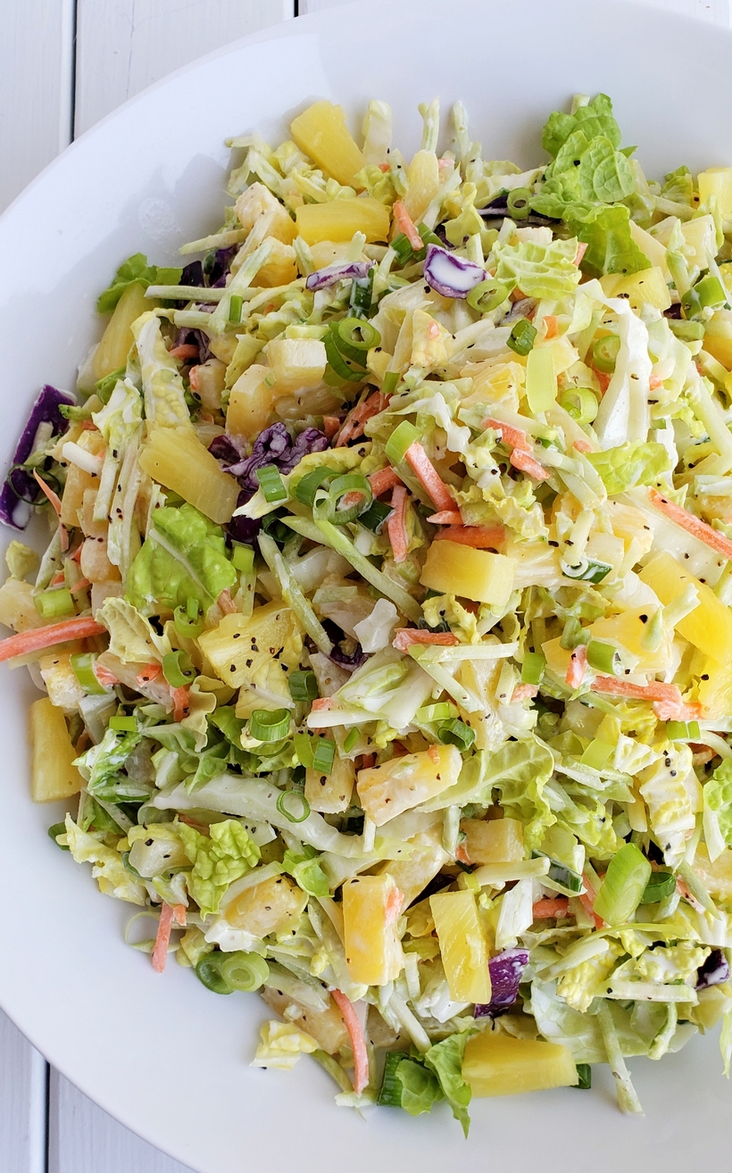 This Easy Pineapple Coleslaw is going to remind you of summer all year long. Enjoy as a side dish or top your favorite chicken burger with this one. pineapple coleslaw
