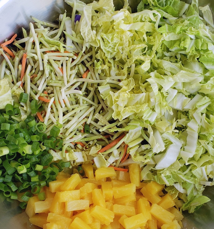 This Easy Pineapple Coleslaw is going to remind you of summer all year long. Enjoy as a side dish or top your favorite chicken burger with this one. coleslaw ingredients