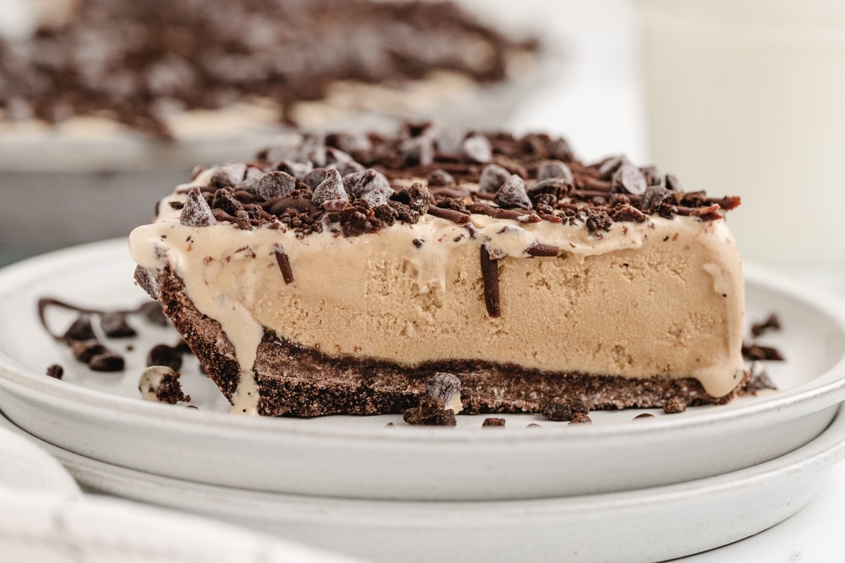 This Mud Pie is a real treat! Coffee-flavored ice cream and chocolate come together for a fantastic combo in every bite. I like to crush up some chocolate-covered espresso beans on top for an extra burst of flavor and a nice crunch. coffee ice cream cake