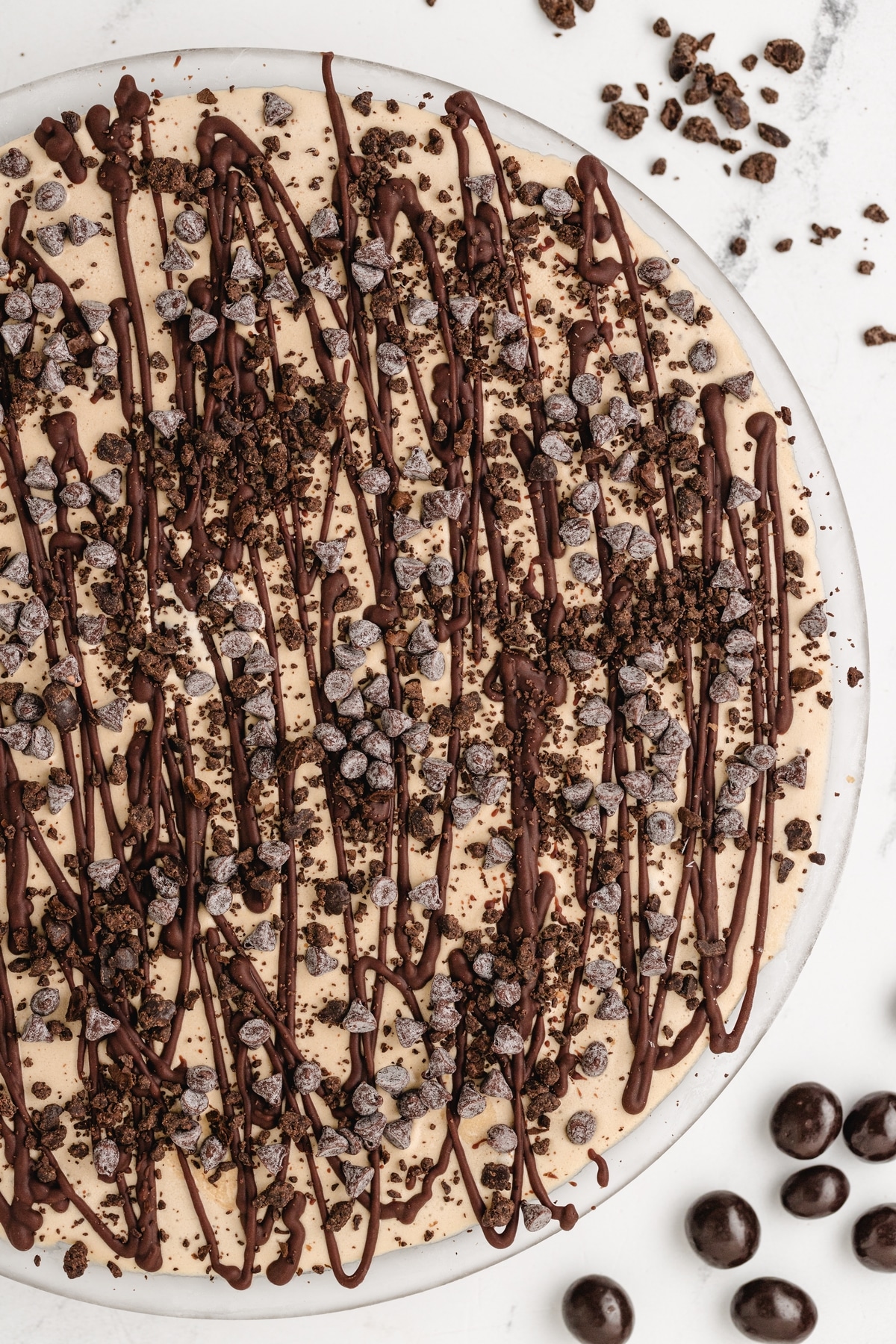 This Mud Pie is a real treat! Coffee-flavored ice cream and chocolate come together for a fantastic combo in every bite. I like to crush up some chocolate-covered espresso beans on top for an extra burst of flavor and a nice crunch. mud pie