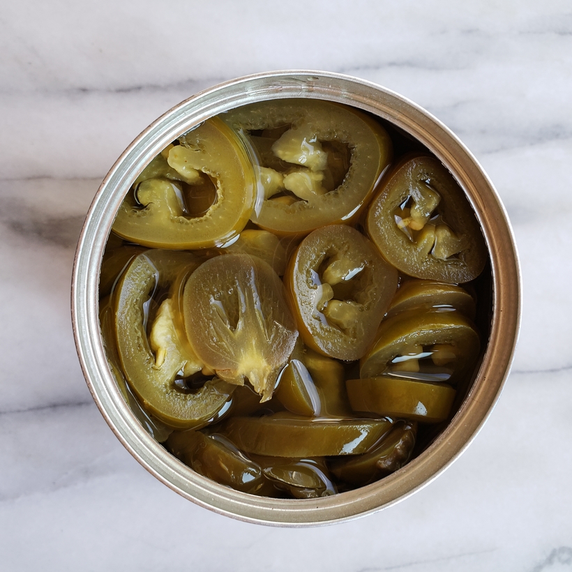 You will be obsessed with this quick and easy 3-Ingredient Blender Salsa that is packed with flavor and spicy heat. Whether you pour it over tacos or use it for chips and dip, I guarantee it will become a fast favorite. #noblepig #salsa #gameday #easyrecipes Jalapenos in a can.
