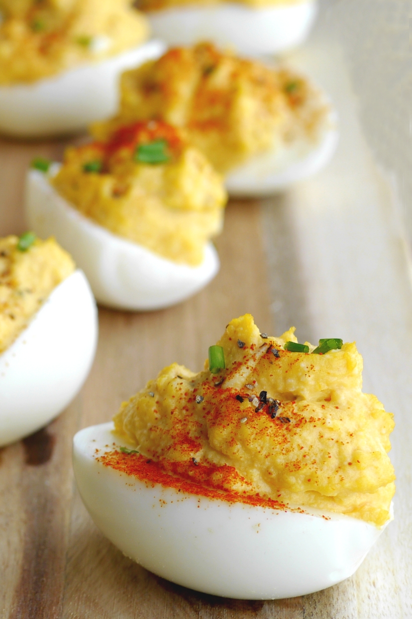 Add a little spice to the appetizer table with these Sriracha Mayo Deviled Eggs. This is a zesty, creamy and splurge-worthy treat you'll want to serve at every event! #noblepig #sriracha #eggs #devliedeggs