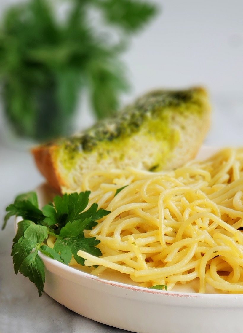 Use up your leftover parsley with this deliciously, flavorful Garlicky, Cheesy Parsley Bread. It's the perfect side dish for a bowl of pasta. #noblepig #parsley #garlicbread