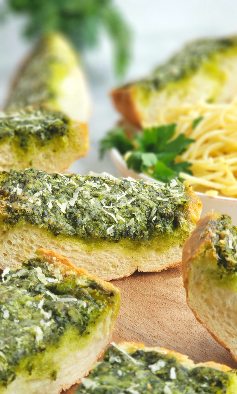 Use up your leftover parsley with this deliciously, flavorful Garlicky, Cheesy Parsley Bread. It's the perfect side dish for a bowl of pasta. #noblepig #parsley #garlicbread