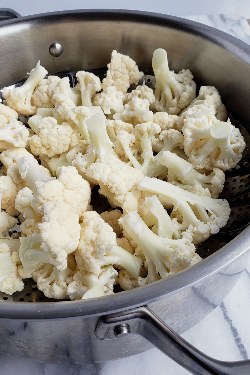 Crispy, cheesy and tasty, these Baked (Low Carb) Parmesan Cauli-Tots are the answer to a healthy dinner side dish everyone in the family will love. #noblepig #cauliflower #tatertots