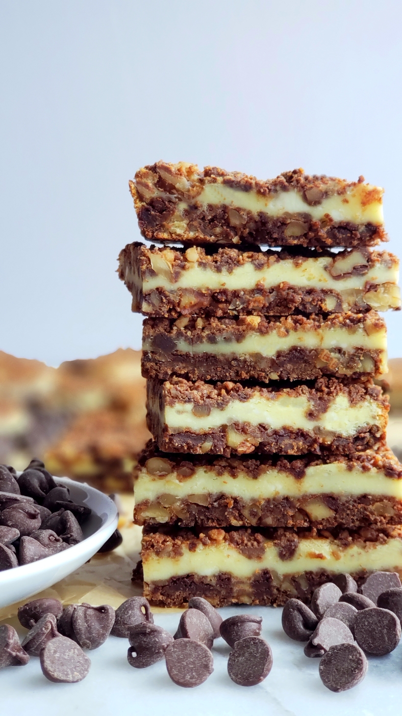 Chocolate Cream Cheese Bars stacked and ready to eat. A stack of Chocolate Cream Cheese Bars