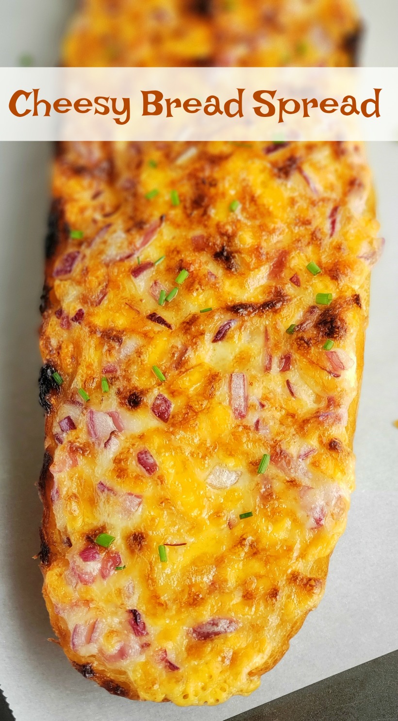 Cheesy Bread Spread will transform your regular loaf of bread into a mouthwatering sensation. Serve this bread with pasta dishes or next to a freshly made salad. #cheesybread