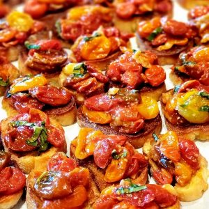 Roasted Garlic Bruschetta on parchment paper.