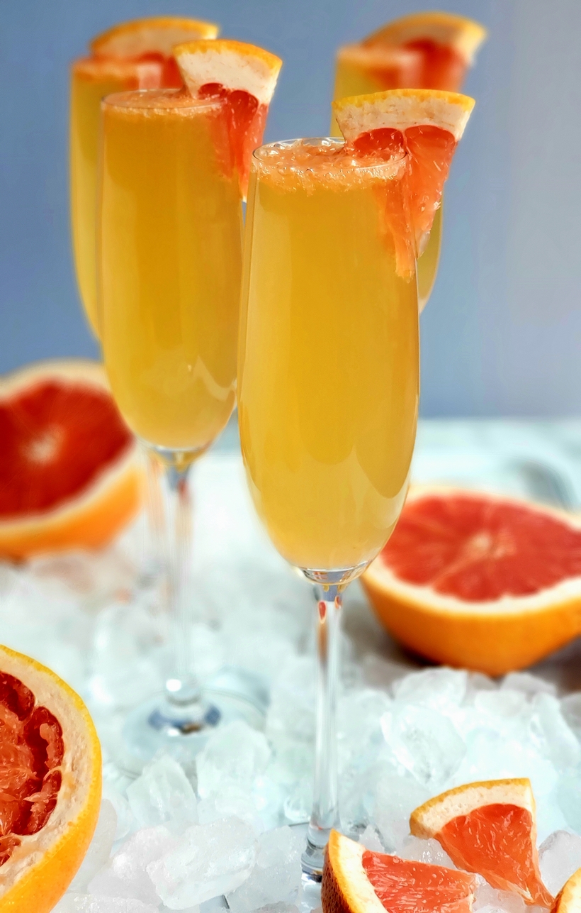 Grapefruit Prosecco Cocktail Grapefruit Prosecco Cocktails on a tray with ice.