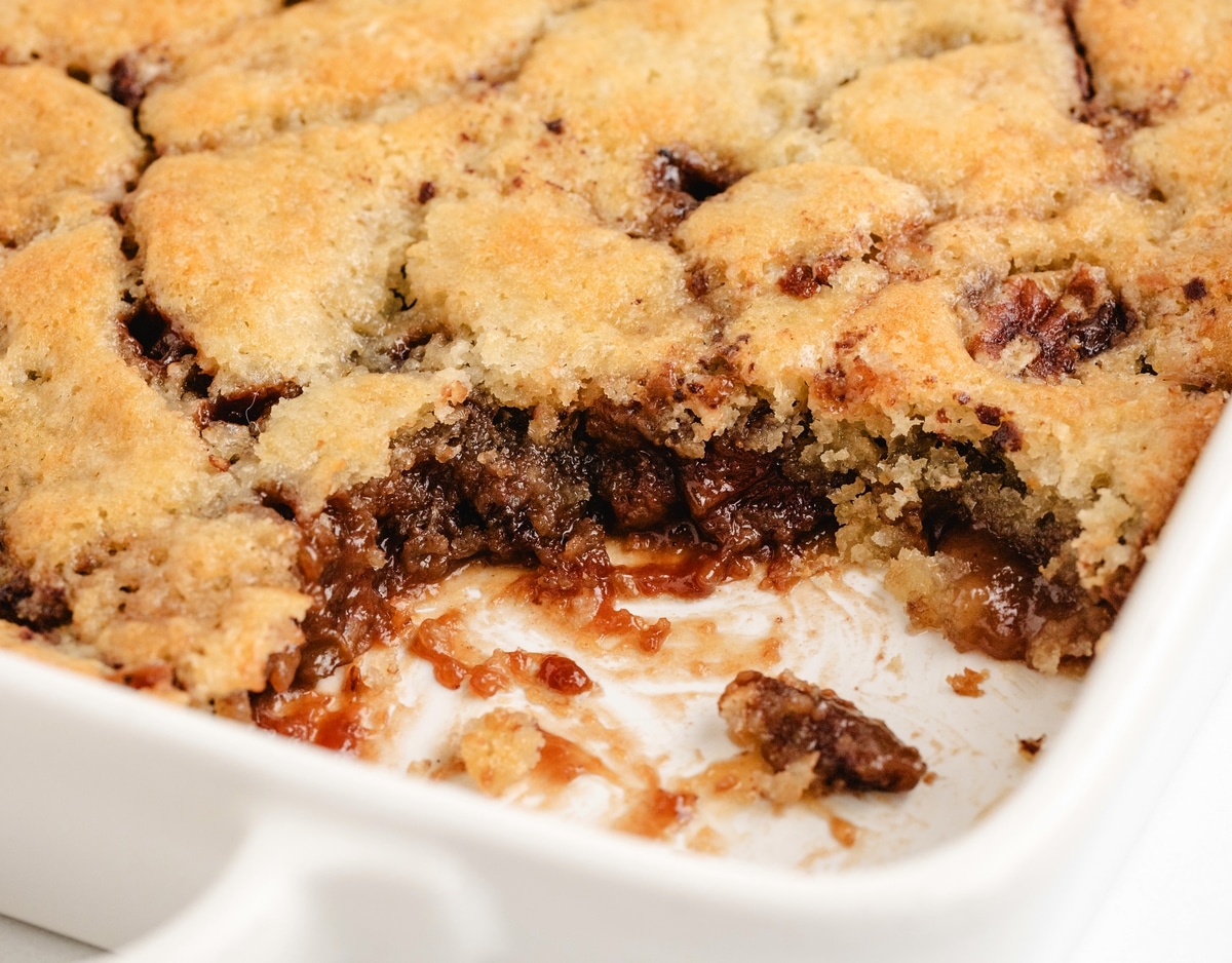 This Pecan Pie Cobbler is the answer to Thanksgiving dessert—rich, nutty, and perfect for a crowd. It keeps the cozy simplicity of cobbler while bringing that deep, classic pecan pie flavor without any eggs. easy pecan pie cobbler