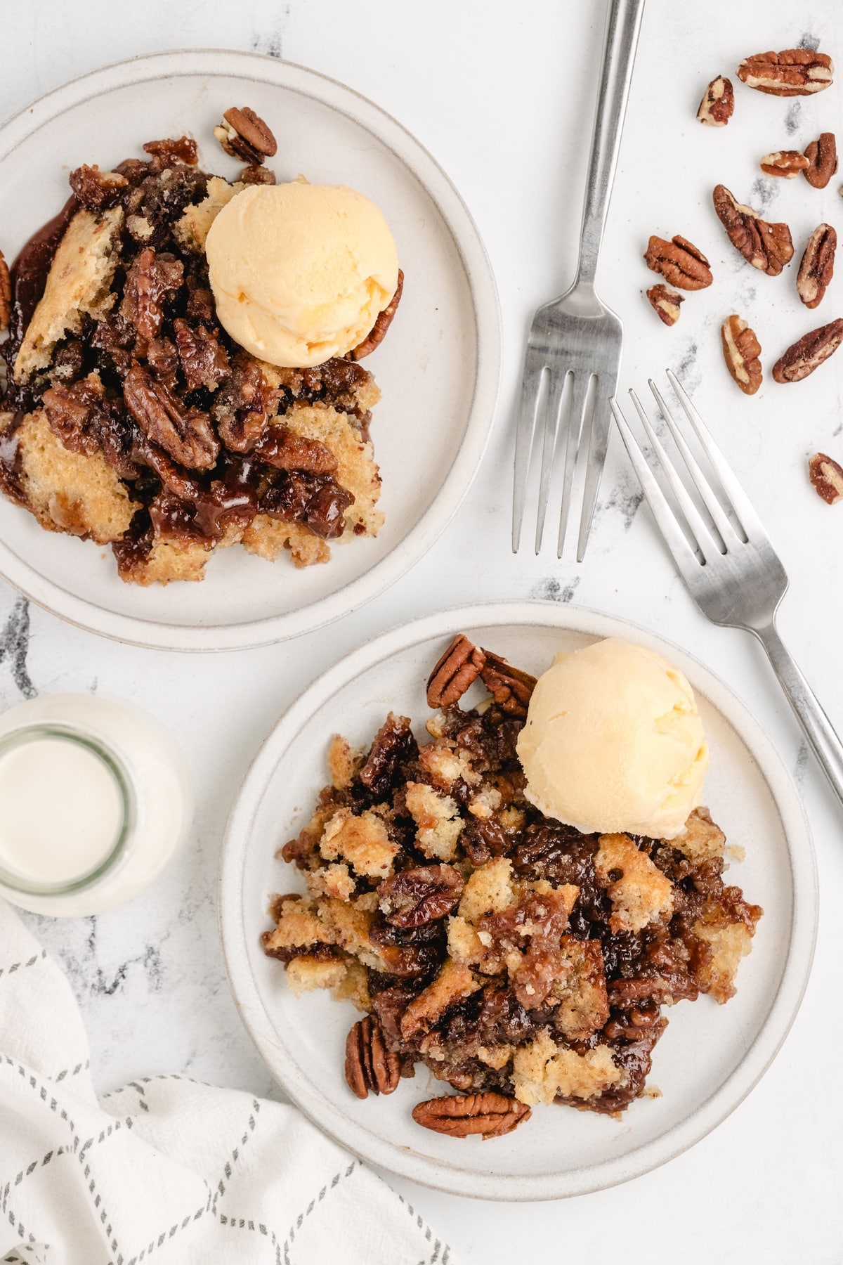This Pecan Pie Cobbler is the answer to Thanksgiving dessert—rich, nutty, and perfect for a crowd. It keeps the cozy simplicity of cobbler while bringing that deep, classic pecan pie flavor without any eggs. pecan cobbler with ice cream
