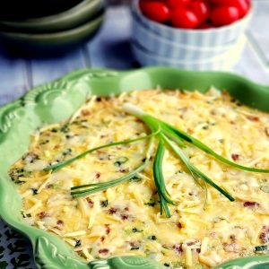 Omelet in a green serving dish.