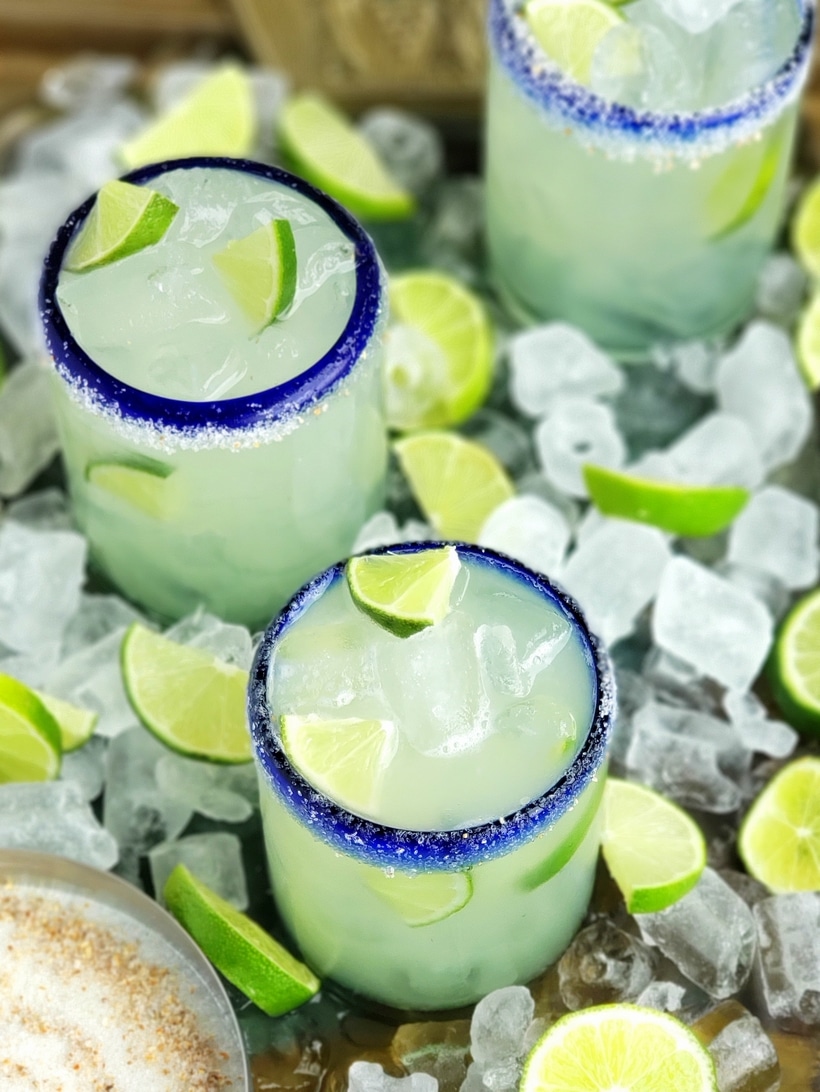 Overhead of agave margaritas in glasses.