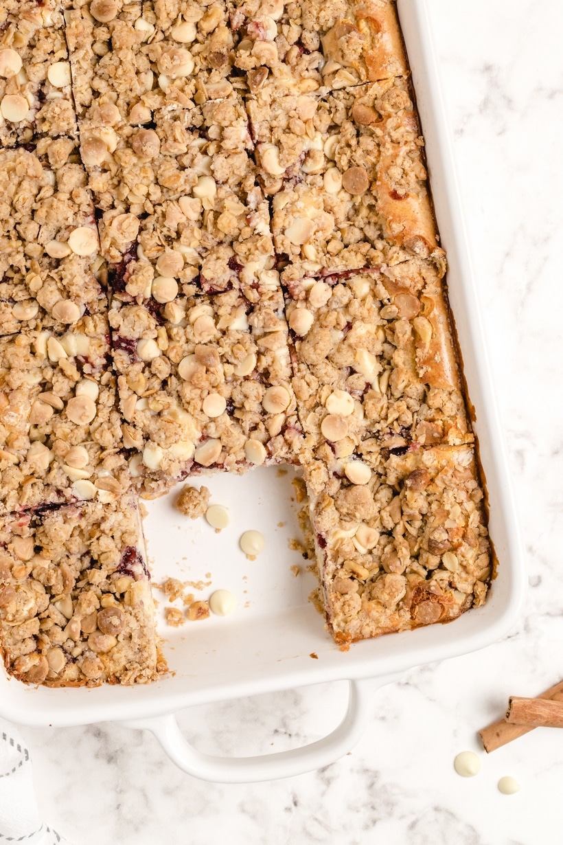 Holiday Cranberry Dessert Bars Ready to Serve A baking dish of creamy cranberry bars.