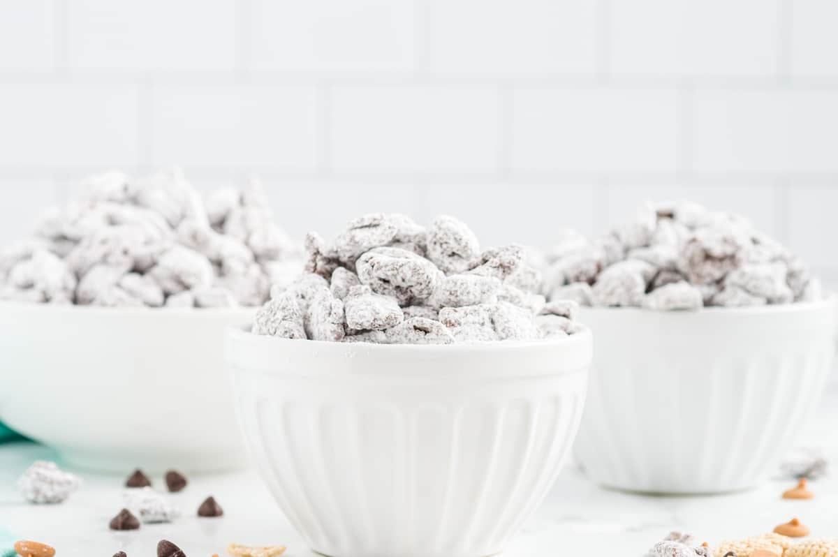 puppy chow dessert in three bowls