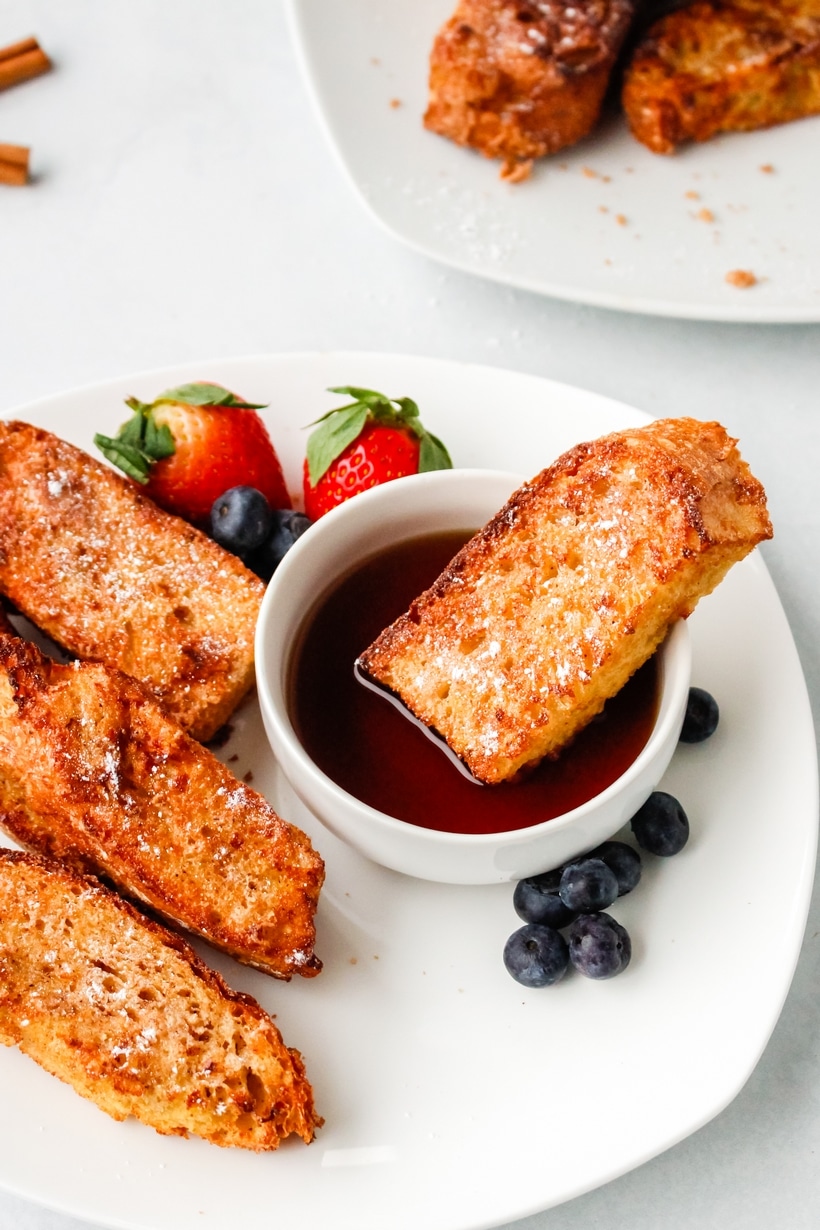 Air Fryer French Toast with fruit. air fryer French toast dipped in maple syrup