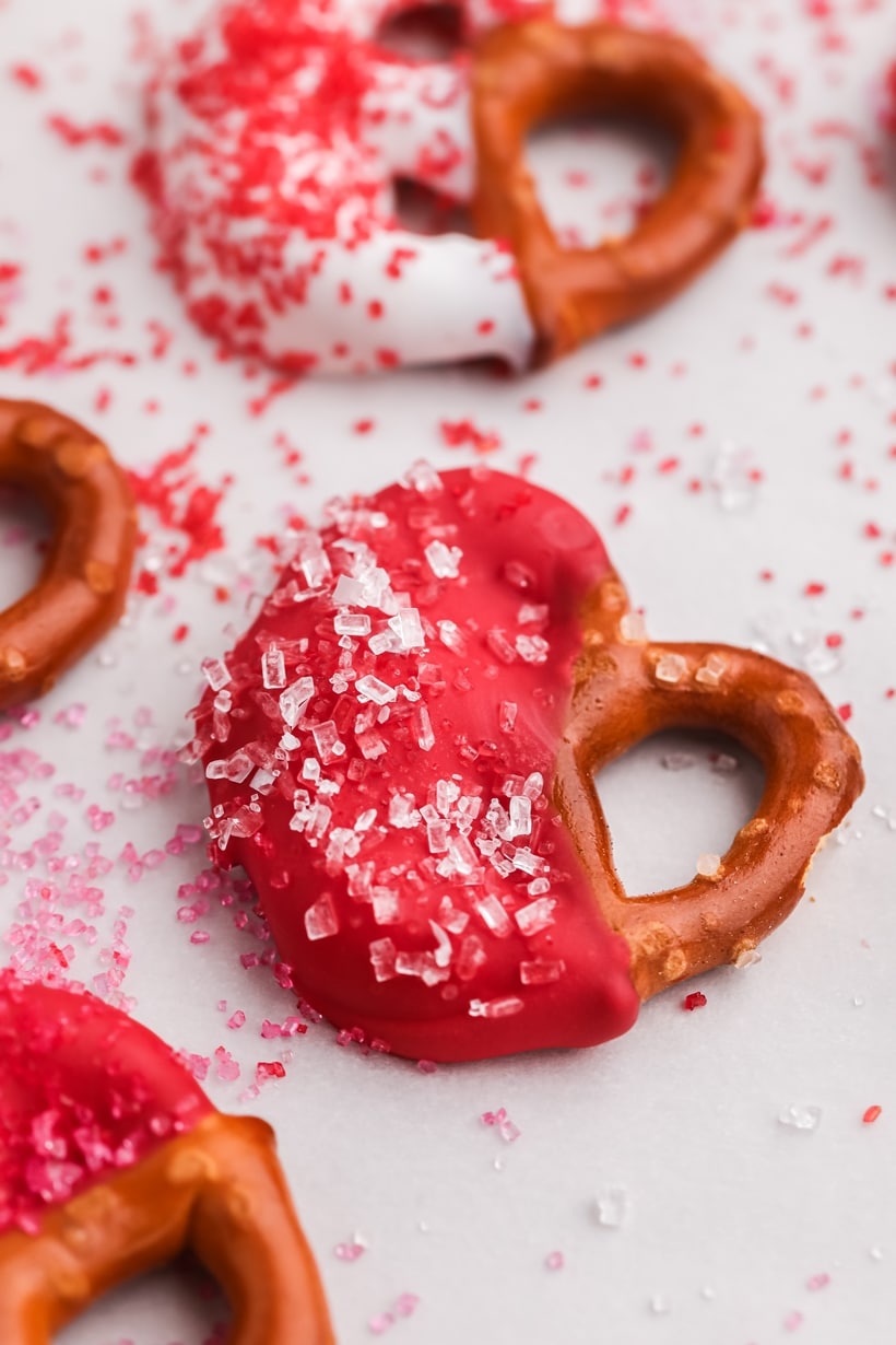 A group of pretzels arranged on a serving tray, ready to eat.