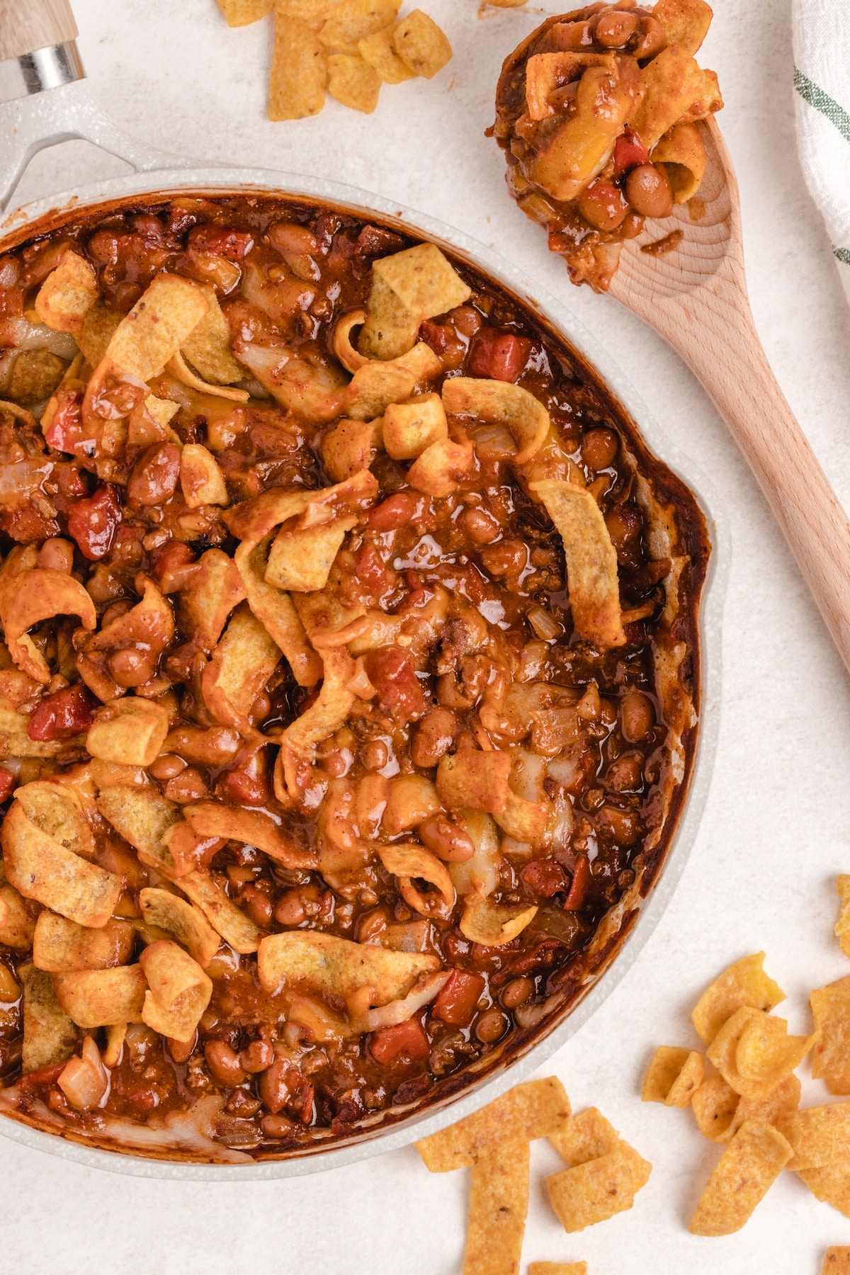 When I need a quick and easy meal (think fifteen minutes), I love making this super simple Frito pie right on the stove top. I use canned chili, unless I have a batch of leftover homemade chili available. It's the best and kids love it too. stove top frito pie