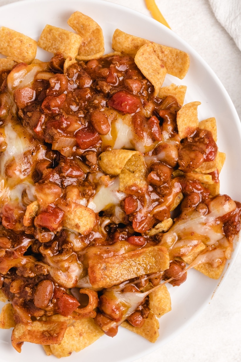 When I need a quick and easy meal (think fifteen minutes), I love making this super simple Frito pie right on the stove top. I use canned chili, unless I have a batch of leftover homemade chili available. It's the best and kids love it too. easy recipe for frito pie