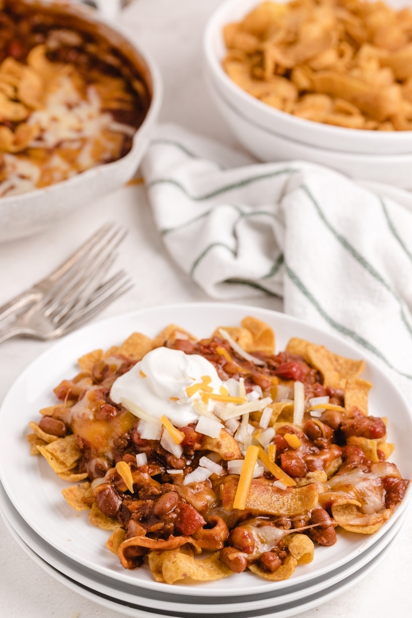 When I need a quick and easy meal (think fifteen minutes), I love making this super simple Frito pie right on the stove top. I use canned chili, unless I have a batch of leftover homemade chili available. It's the best and kids love it too. walking tacos