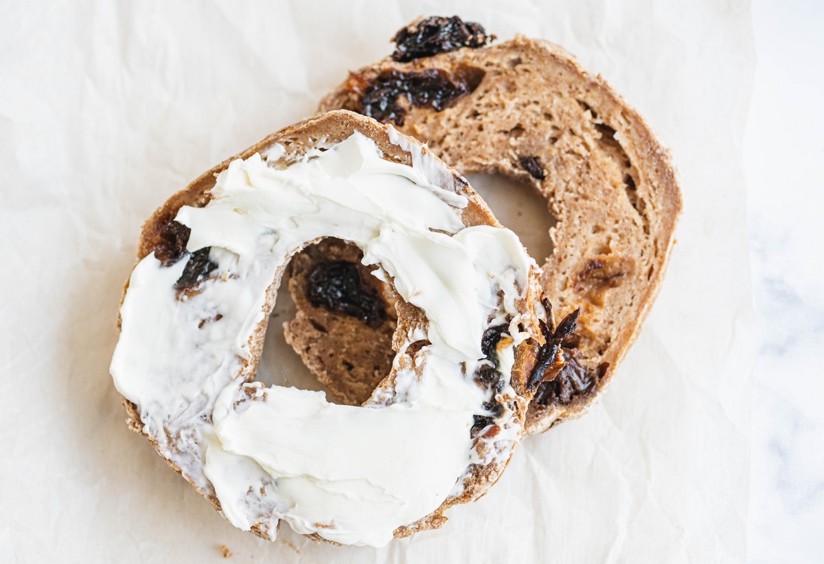 sliced air fryer cinnamon raisin bagel with cream cheese