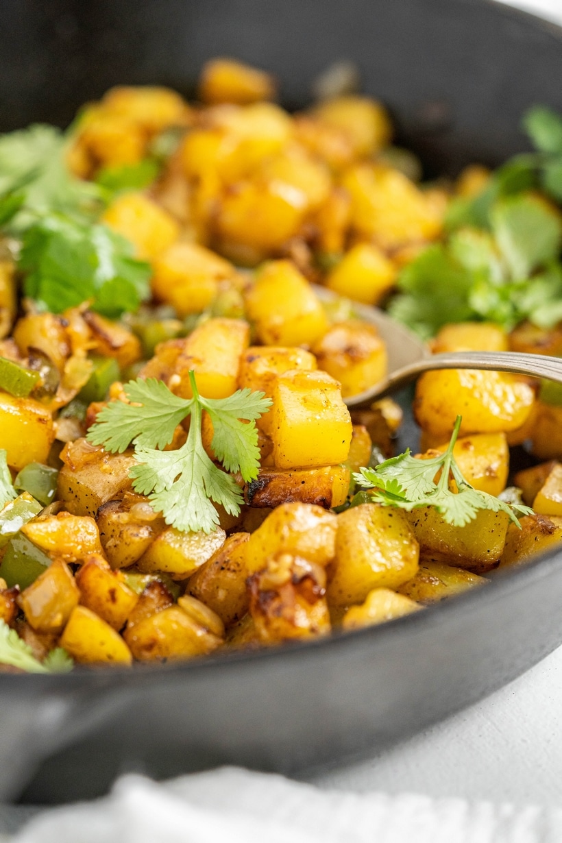 When it comes to making good home fries, stay away from waxy potatoes like red, fingerlings and new potatoes. Those varieties of potatoes work well in recipes where keeping their shape is important (think potato salad), unlike home fries. Waxy potatoes don’t break down the way starchy potatoes (Yukon Gold and Russets) do during the cooking process. Instead, a waxy potato holds on to its firm texture, never quite mastering that soft, creamy texture that make home fries so satisfying and delicious. home fries recipe