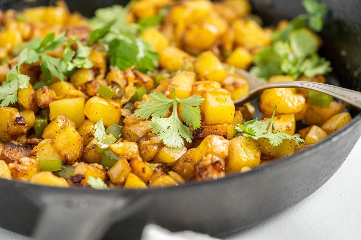 When it comes to making good home fries, stay away from waxy potatoes like red, fingerlings and new potatoes. Those varieties of potatoes work well in recipes where keeping their shape is important (think potato salad), unlike home fries. Waxy potatoes don’t break down the way starchy potatoes (Yukon Gold and Russets) do during the cooking process. Instead, a waxy potato holds on to its firm texture, never quite mastering that soft, creamy texture that make home fries so satisfying and delicious. home fries