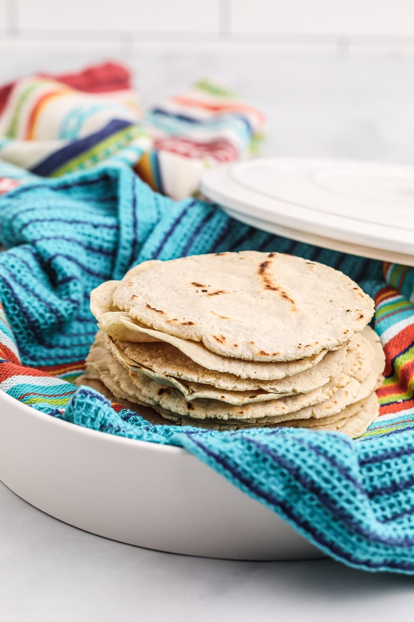 Once you make homemade corn tortillas, you will never buy them again. Corn tortilla making from scratch is a simple two-ingredient process. corn tortilla recipe