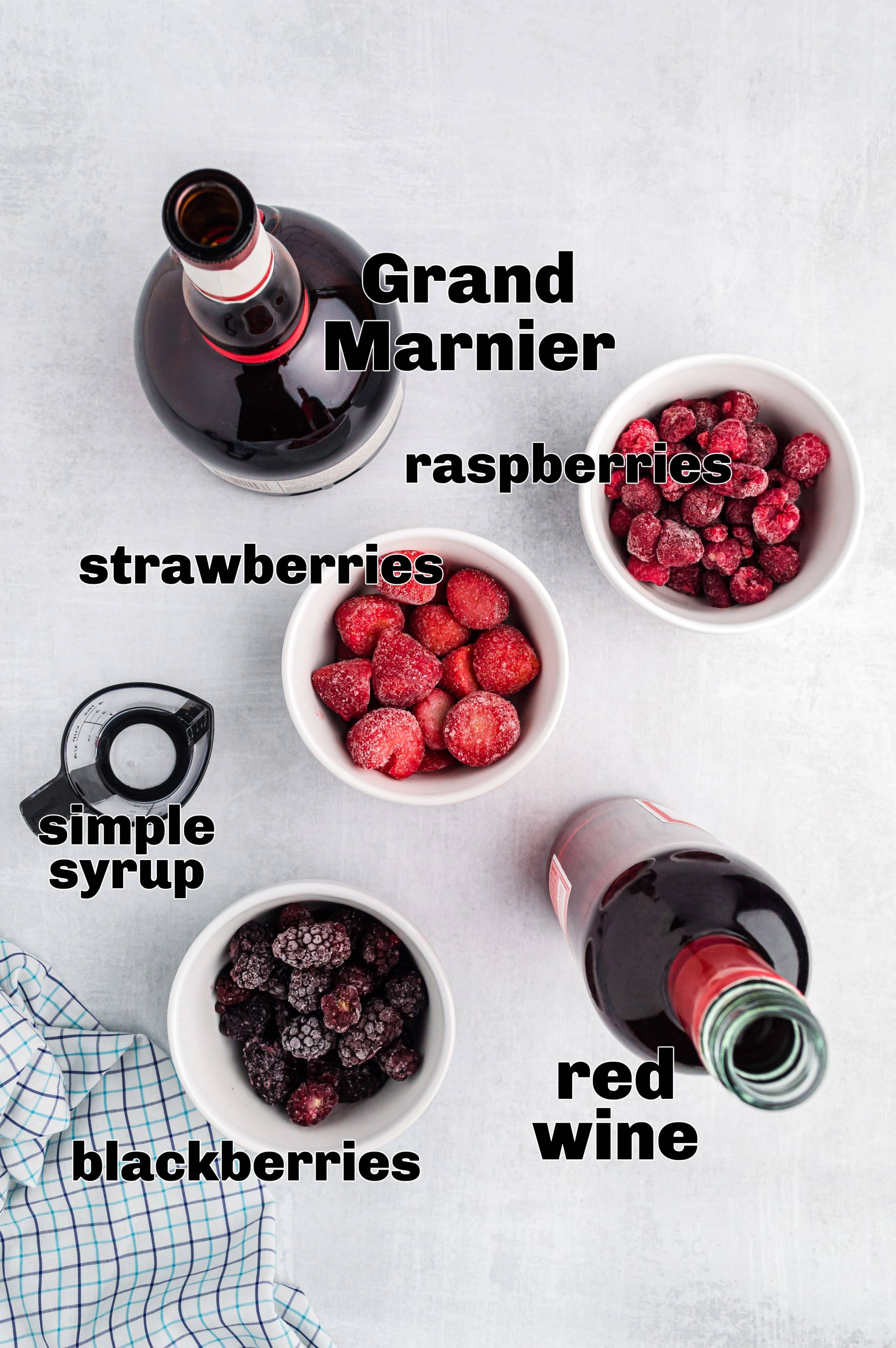 Ingredients for red wine slushie measured out on a surface