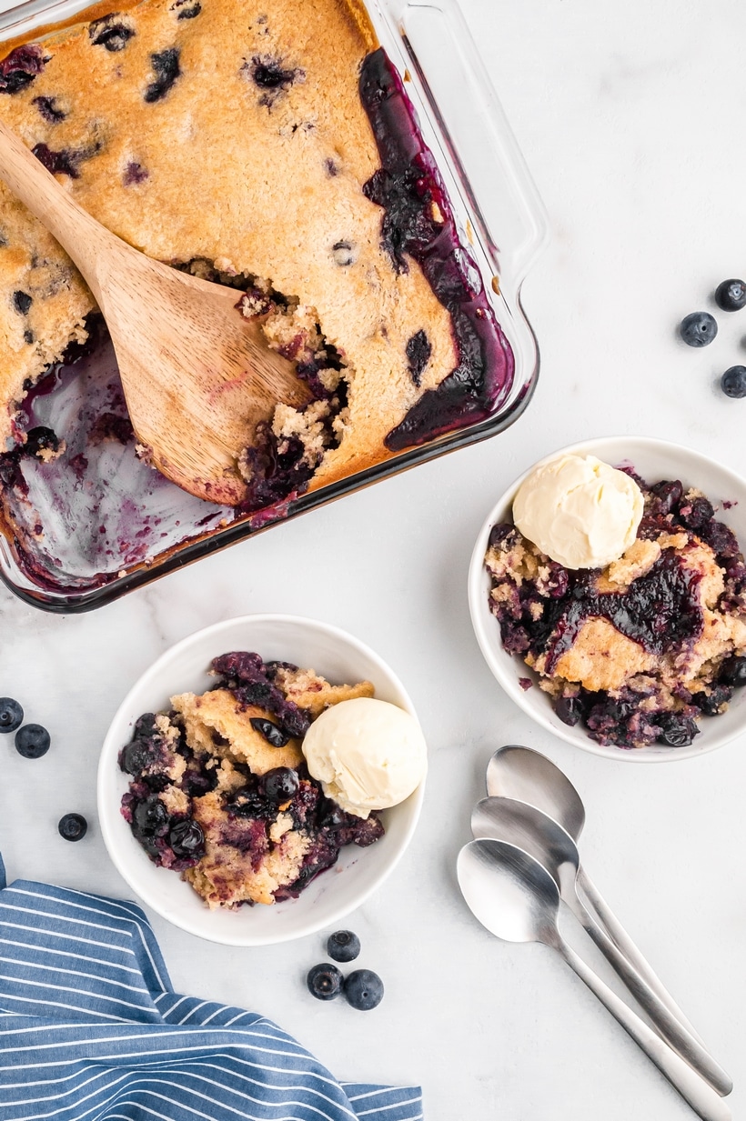 A delicious Blueberry Cobbler with one secret ingredient to make it the best you've ever had! This cobbler can also be made year round utilizing fresh or frozen berries. delicious blueberry cobbler