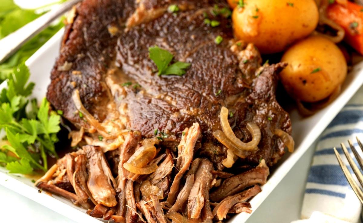 Shredded beef pot roast with gravy and vegetables fork tender shredded beef pot roast with rich brown gravy and tender vegetables