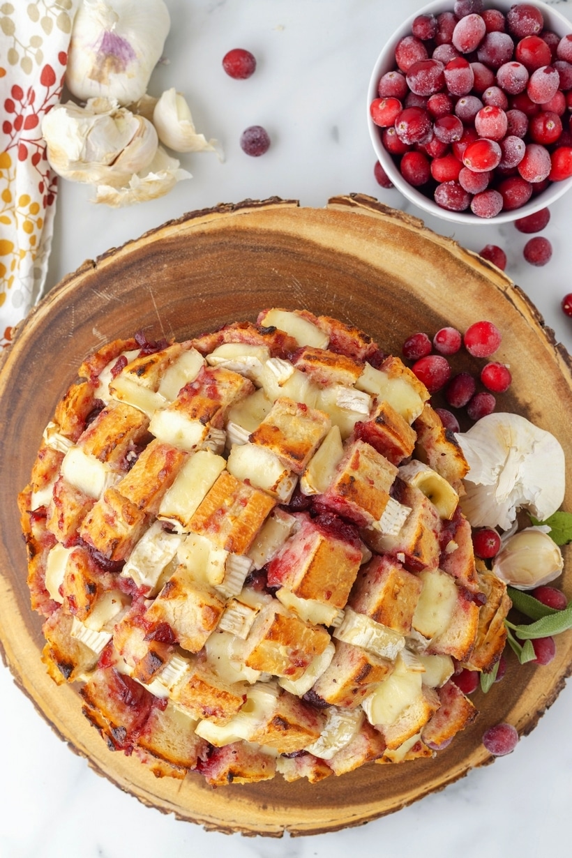 Sliced cranberry pull-apart bread with melted Brie cheese