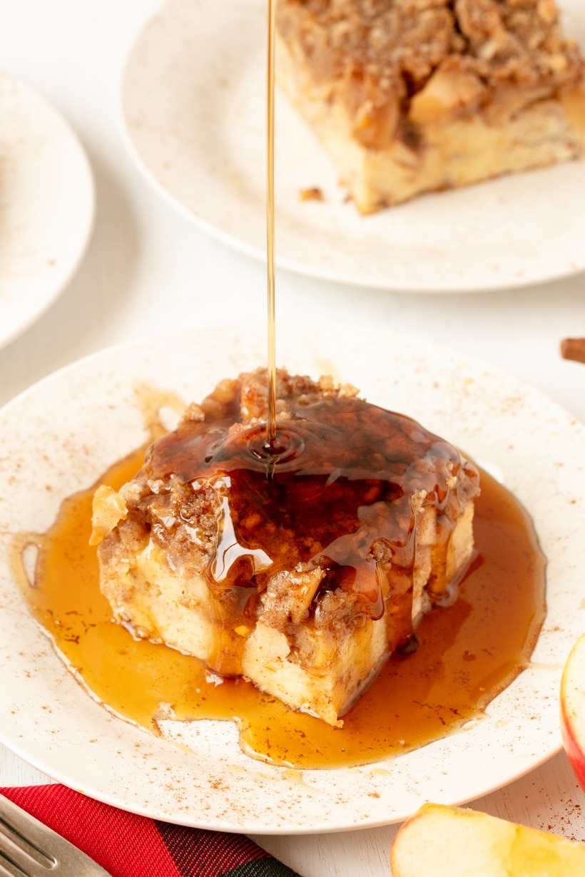 Apple Pie French Toast Casserole with Apple Pie Filling Apple pie french toast casserole with syrup poured over a warm slice.